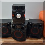 E06. LG Home stereo shelf system speakers (practically new) model CM4550 